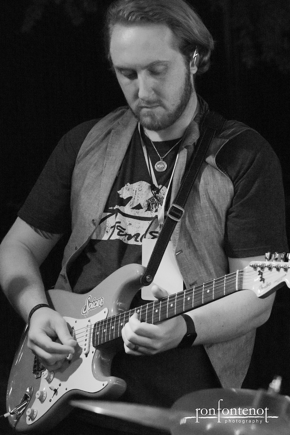 Black-and-white photo of Patrick Spicer Cassidy performing electric guitar during the Red Lightning Blues live guitar session.
